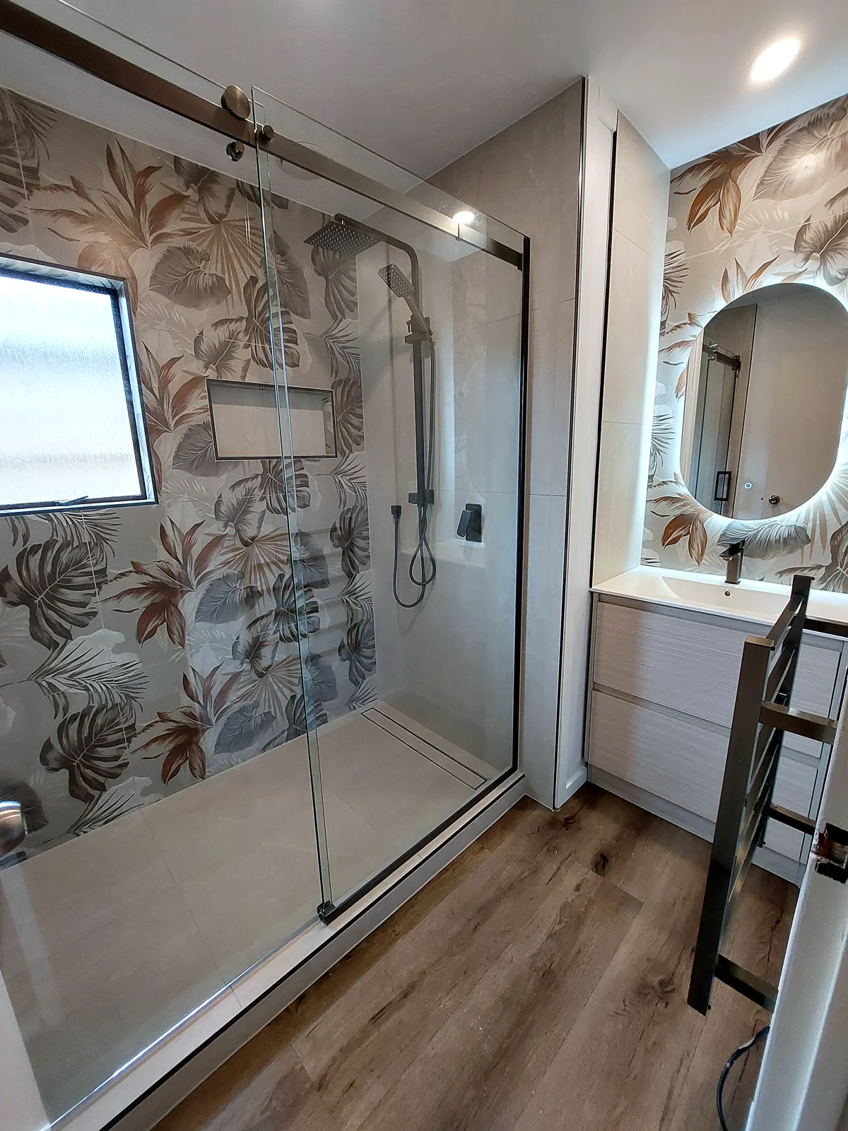 Renovated Auckland bathroom with tiled feature wall — cost guide